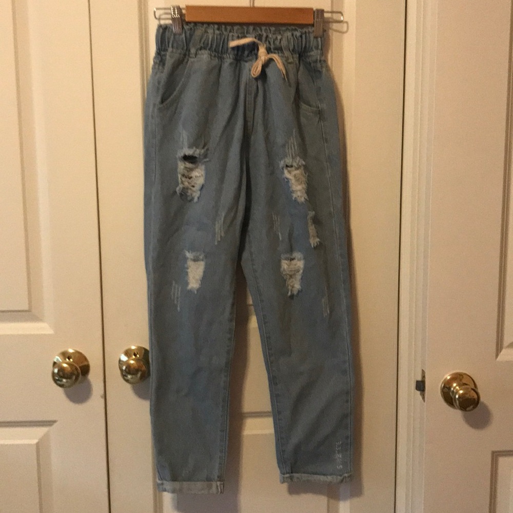 Never worn distressed denim jeans